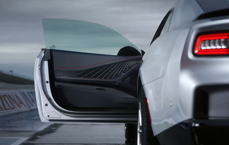 Rear view of a silver vehicle with their driver seat open