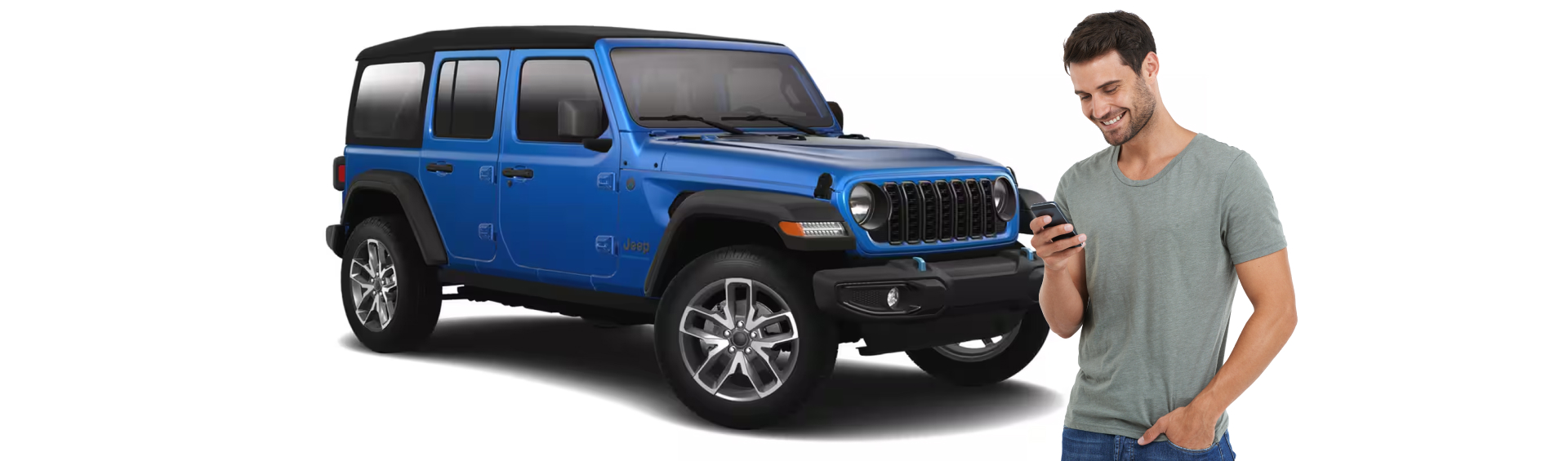 Man looking at his phone infront of a Jeep Wrangler