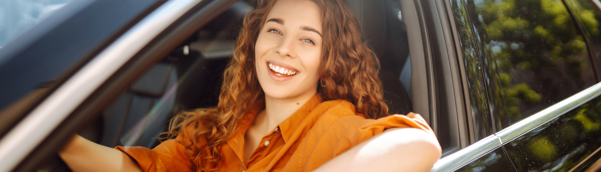 First Time Buyer driving off in her new vehicle