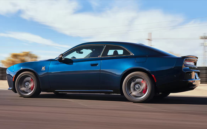 Blue Dodge Charger driving on the road