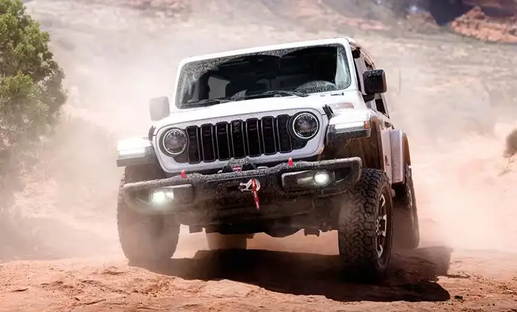Jeep Wrangler driving up rocky terrain
